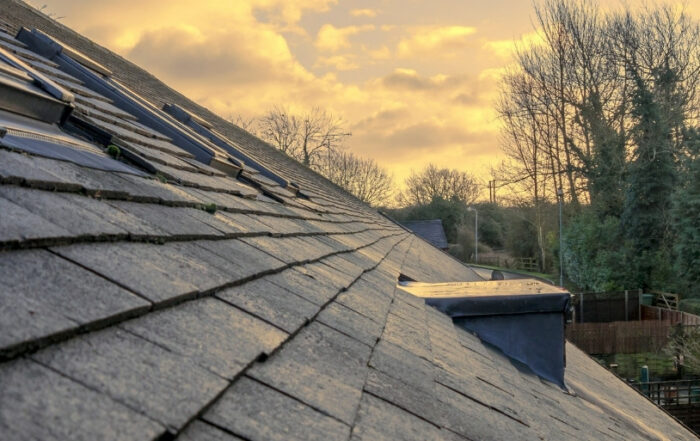 Spring roof maintenance tips for Iowa homeowners by JB Roofing & Gutters — clean, well-maintained shingles shown during a seasonal roof inspection